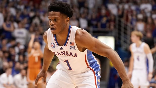 Kansas junior guard Joseph Yesufu (1) watches the ball after a possession change in the first half of Monday's game against Texas inside Allen Fieldhouse.